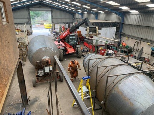 Mixer drums in workshop.JPG